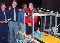 Some of the entrants from the Durban Institute of Technology show off their masterpiece. The mechanical structure of their project was sponsored by the SAIMC